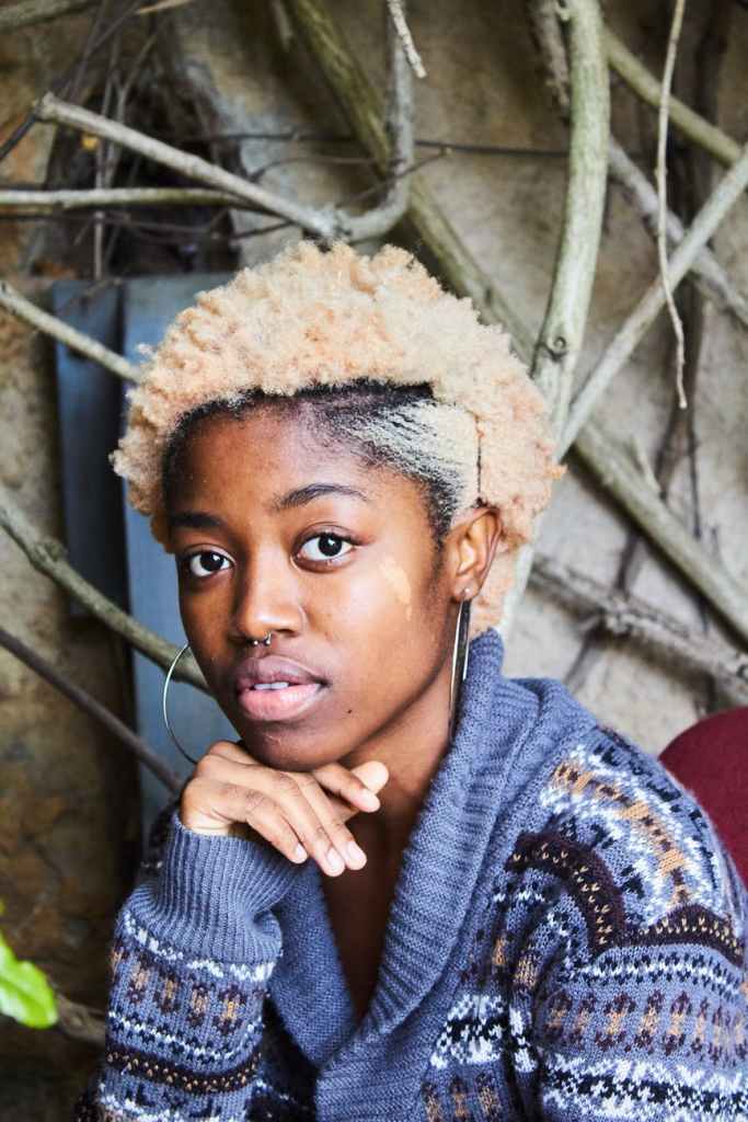 woman wearing purple top